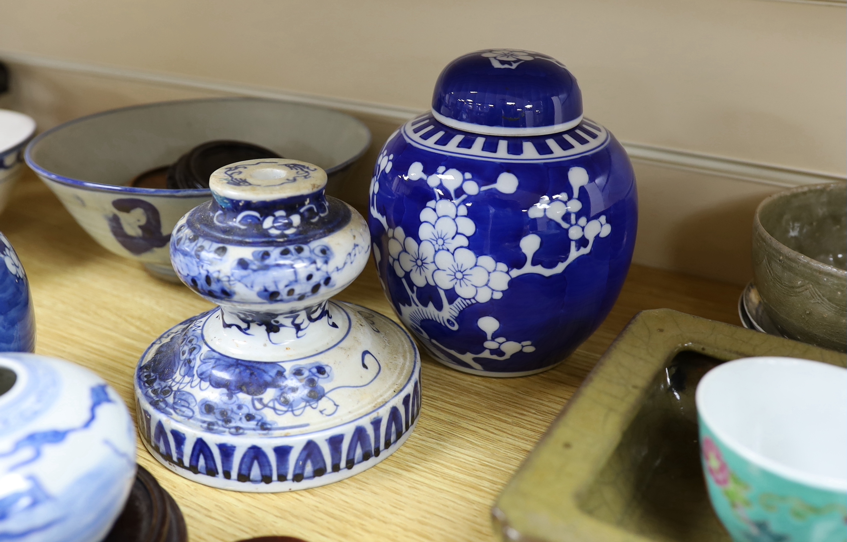 A collection of Chinese hardwood stands and a soapstone example, largest 29cm wide